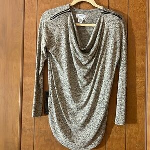 Women’s Carmen Marc Valvo long sleeve top with zipper shoulder detail.